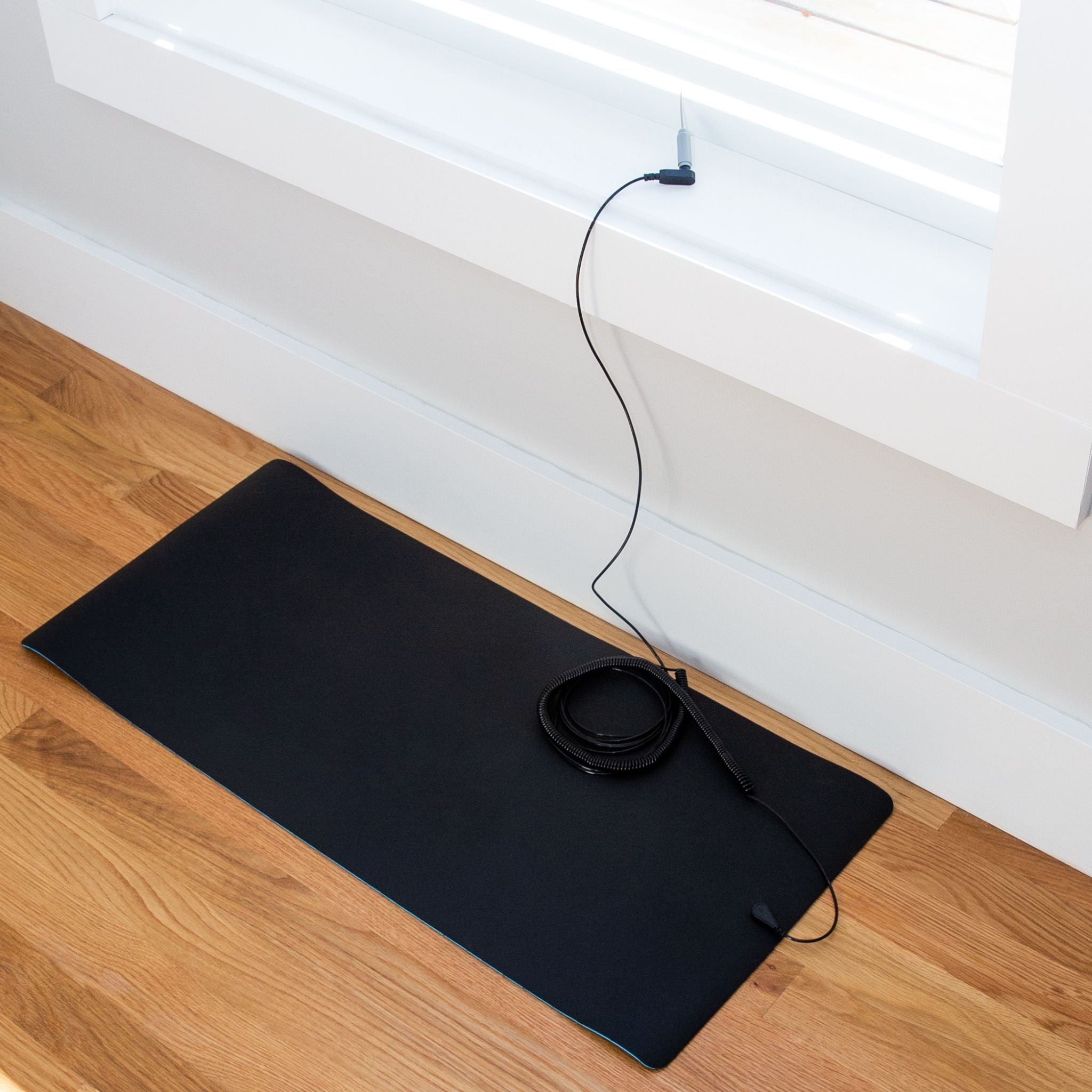 The Earthing Coil Cord connects to your Earthing product and also to the Ground Rod, which then goes out the window and into the earth. (1908689109105)